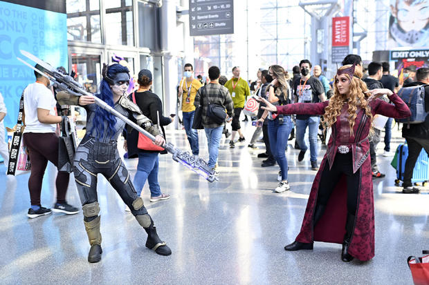 Proxima Midnight and The Scarlet Witch cosplayers pose during New York Comic Con 2022 on October 06, 2022 in New York City. 