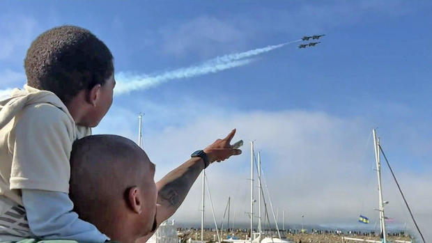 Father and son watching SF Fleet Week air show 