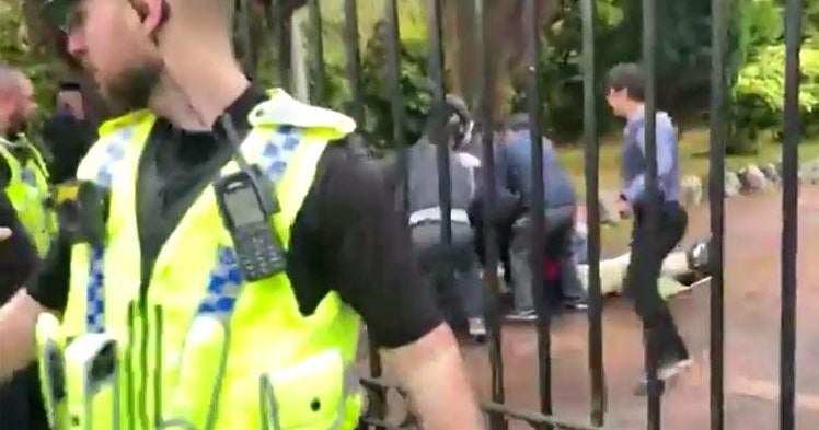 U.K. police probe "deeply concerning" attack on protester at China's consulate in Manchester, England