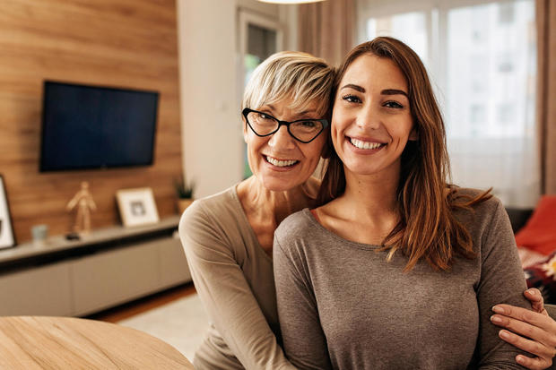 Portrait of a Caucasian mother and daughter bonding at home 