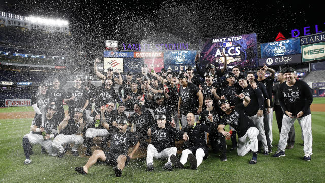 The New York Yankees celebrate on the field after defeating the Cleveland Guardians in game five of the American League Division Series at Yankee Stadium on October 18, 2022 in New York, New York. 