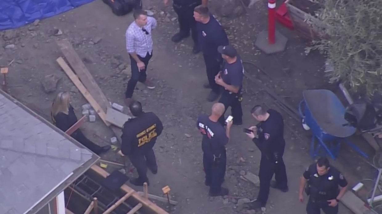 Police investigating after landscapers find car buried decades ago in