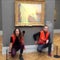 Climate activists throw mashed potatoes on a Monet painting to protest fossil fuel extraction