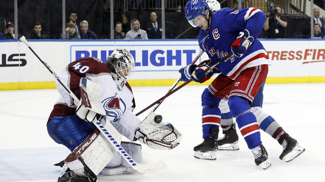 Alexandar Georgiev #40 of the Colorado Avalanche makes a save on a shot from Jacob Trouba #8 of the New York Rangers during overtime at Madison Square Garden on October 25, 2022 in New York City. 