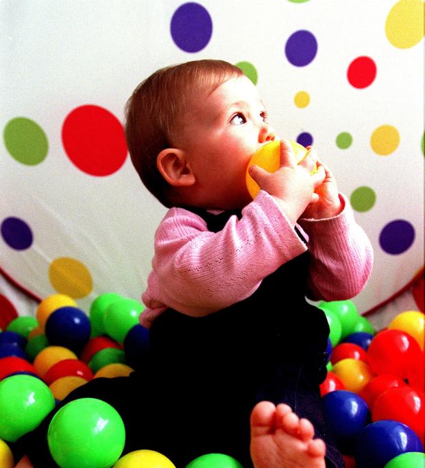 Baby girl playing with balls on 25 November 2000 AFR NEWS Picture by LOUISE KEN 