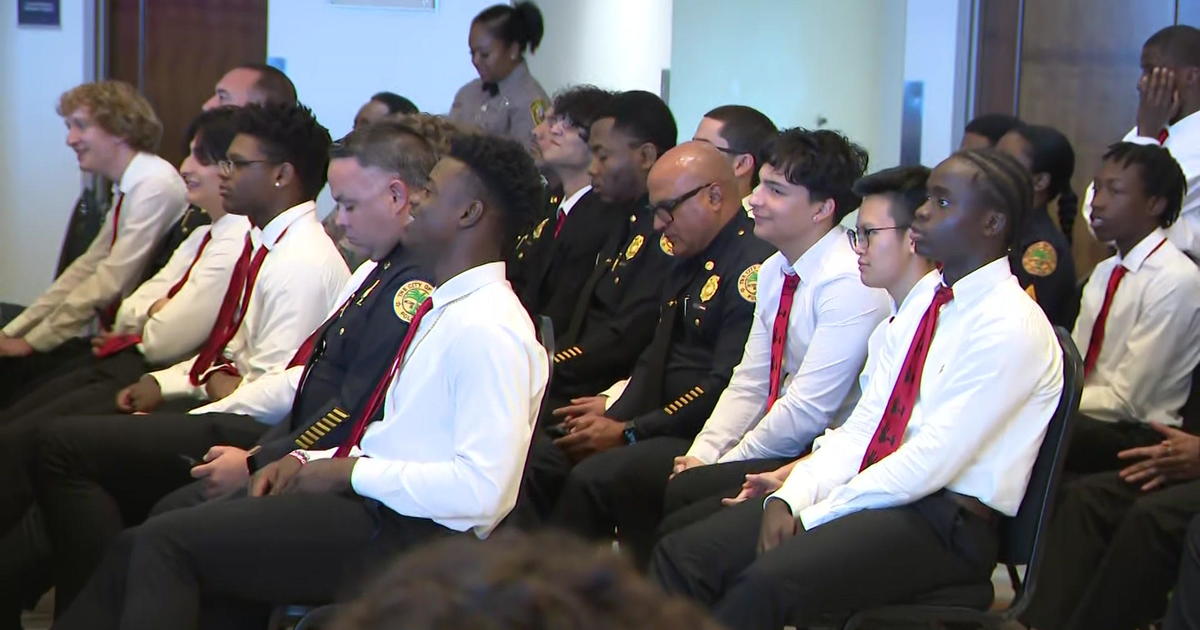 Law enforcement officers switch roles with college students at Tough Rock Stadium for a excellent lead to