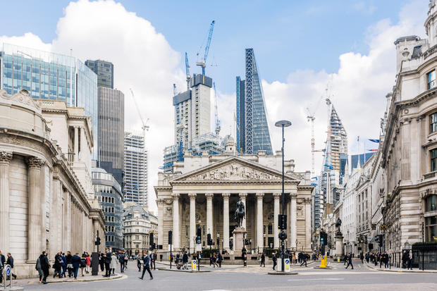 Street in City of London with Royal Exchange, Bank of England and new modern skyscrapers, England, UK 