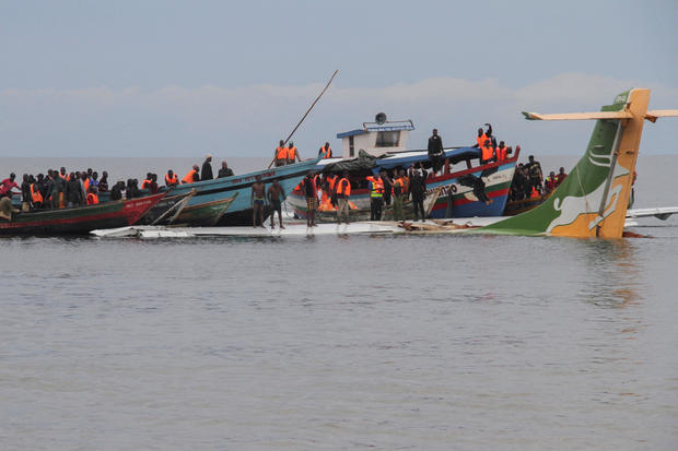 Rescuers attempt to recover the Precision Air passenger plane that crashed into Lake Victoria in Bukoba 
