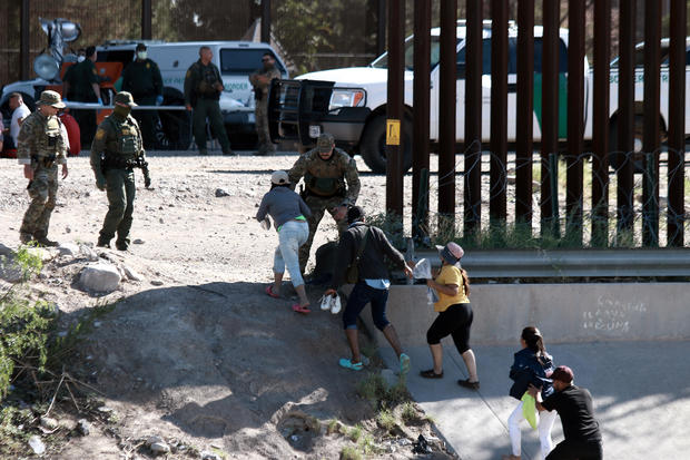 Migrants from Venezuela cross the Rio Grande 