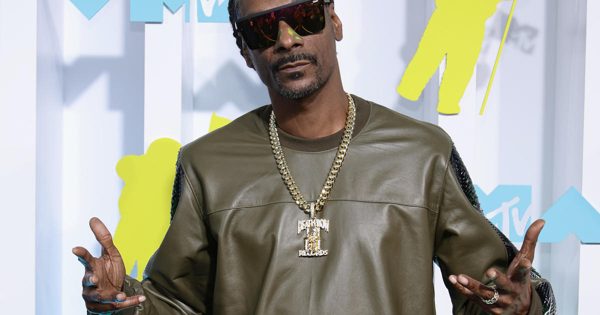 Snoop Dogg's life story is headed to the big screen in deal with Universal Pictures: "It was holy matrimony, not holy macaroni"