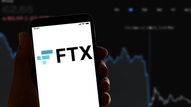 In this photo illustration, the online crypto firm FTX logo 