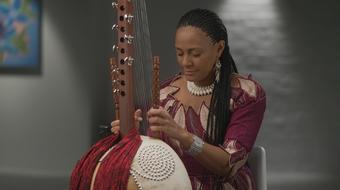 Playing the complex West African instrument called the kora 