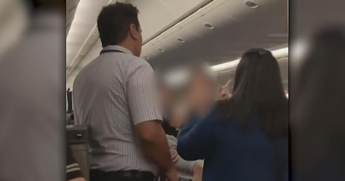 Woman holding child allegedly attacks flight attendant on flight from San Francisco