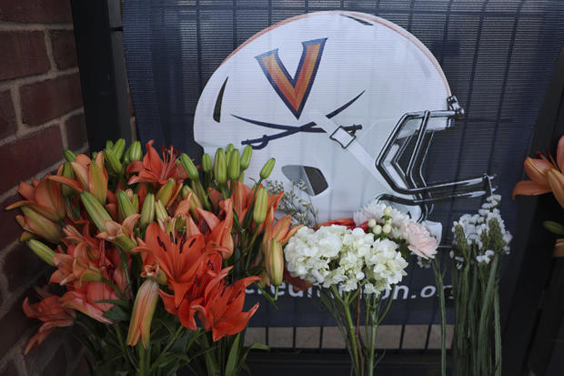 Flowers were left outside Scott Stadium at a makeshift memorial for three slain University of Virginia football players on November 14, 2022, in Charlottesville, Virginia. 