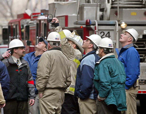 (03/05/03 - Boston, MA) Construction engineers consult with a Boston fire chief at the scene of a structural collapse at a parking garage on the grounds of Mass General Hospital. (030502collapsejh - Staff Photo by Jon Hill. Saved in thurs/photo6) 