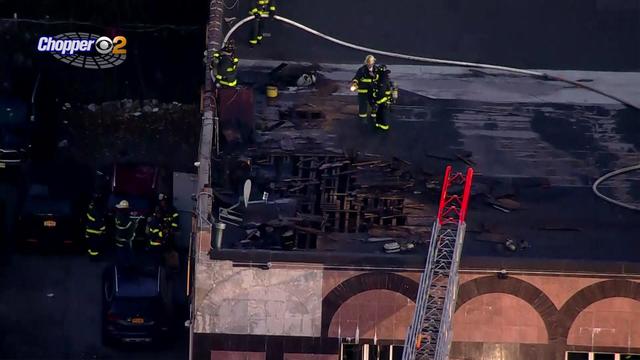 An aerial shot of fire damage to the roof of a building. 