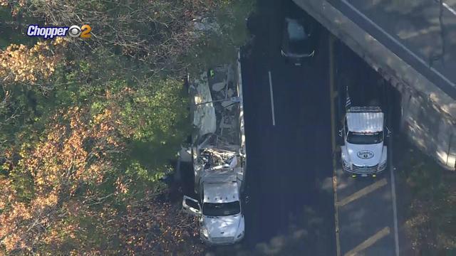 An aerial shot of a tractor trailer that has had its roof sheared off. 