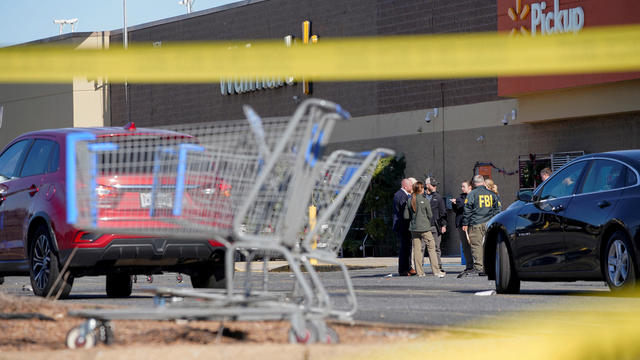 FBI agents are seen outside a Walmart in Chesapeake, Virginia, after a mass shooting November 23, 2022. 