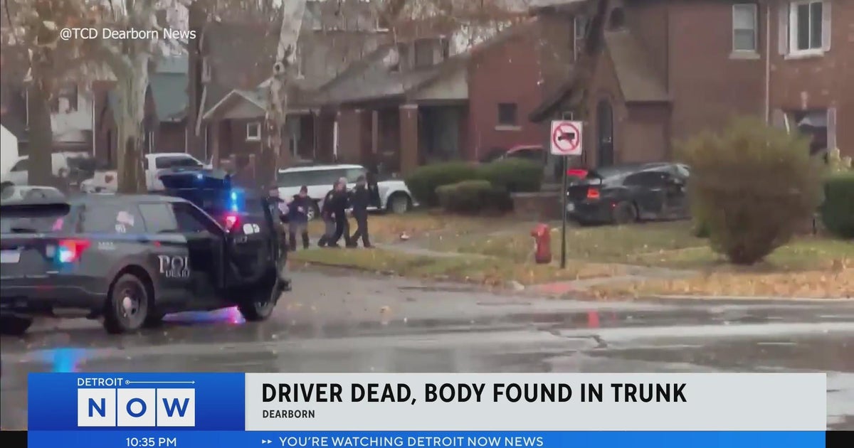 Neighbors say scene "was like a movie" after dead body found in trunk
