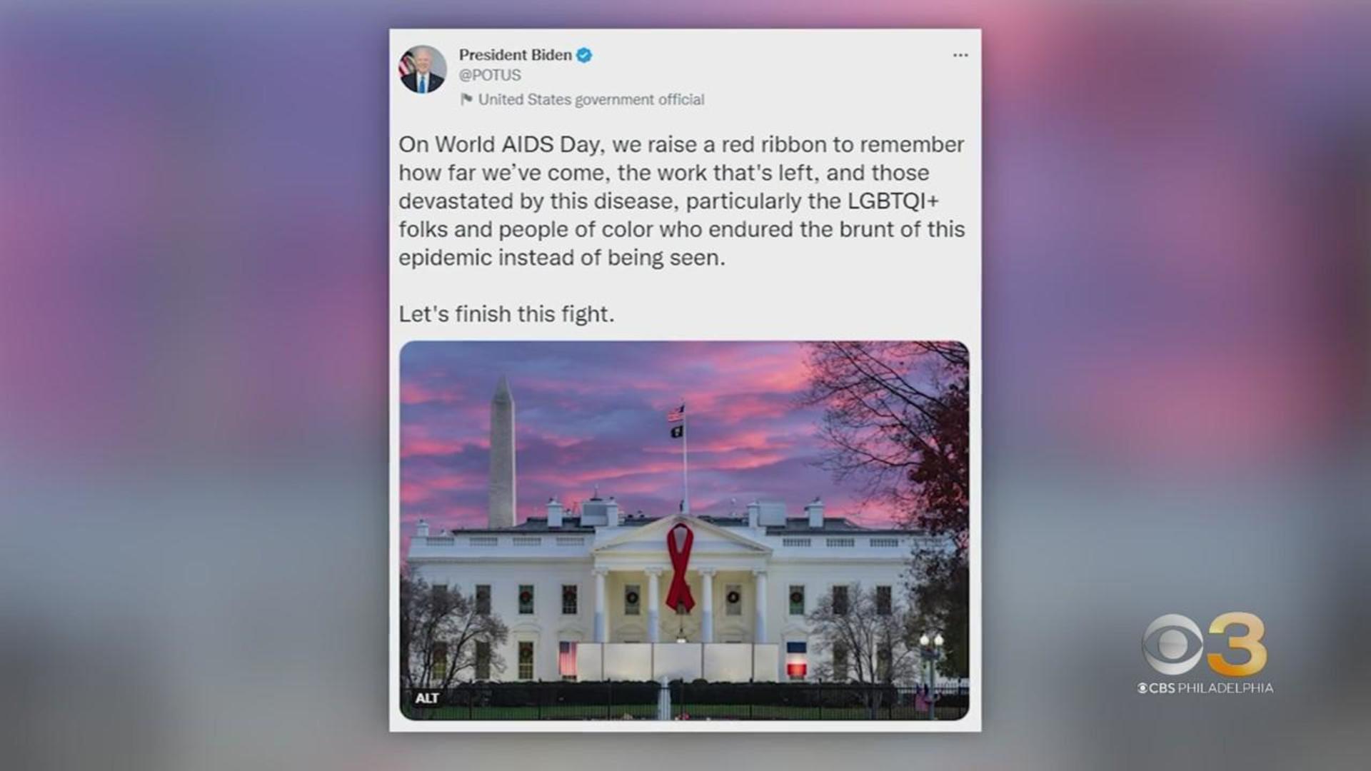 White House hangs red ribbon for World AIDS Day - CBS News