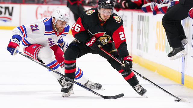 Erik Brannstrom #26 of the Ottawa Senators controls the puck against Barclay Goodrow #21 of the New York Rangers at Canadian Tire Centre on November 30, 2022 in Ottawa, Ontario, Canada. 