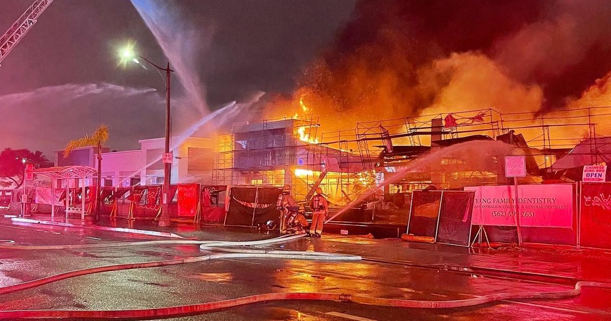 Four-Alarm fire rips through vacant strip mall in Long Beach - CBS