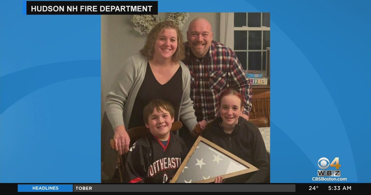 Firefighter saves sentimental American flag from burning home - CBS Boston