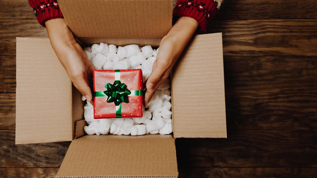 Concept of receiving or shipping Christmas parcel at home 