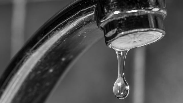 Close-Up Of Water Dripping From Faucet 
