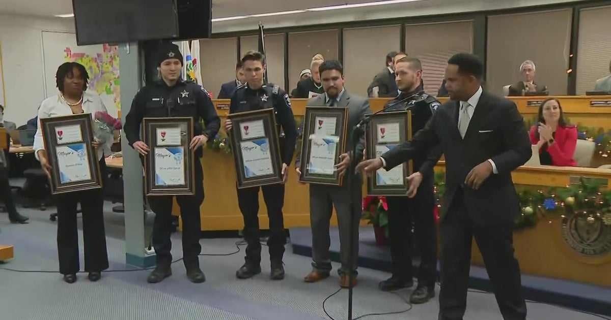 Aurora police officers honored for rescuing boy, woman from frozen pond ...