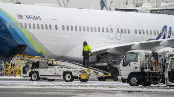 Massive storm cancels hundreds of flights as "crippling impacts" expected 