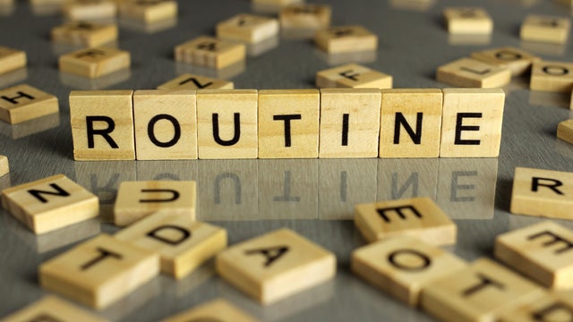 Word,Routine,Is,Made,Up,Of,Square,Wooden,Letters,On 