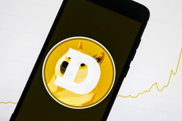 Dogecoin logo displayed on a mobile phone 