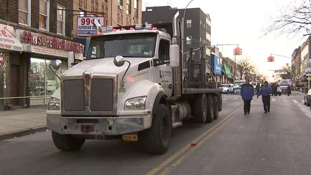 A large truck sits on a Brooklyn street. 