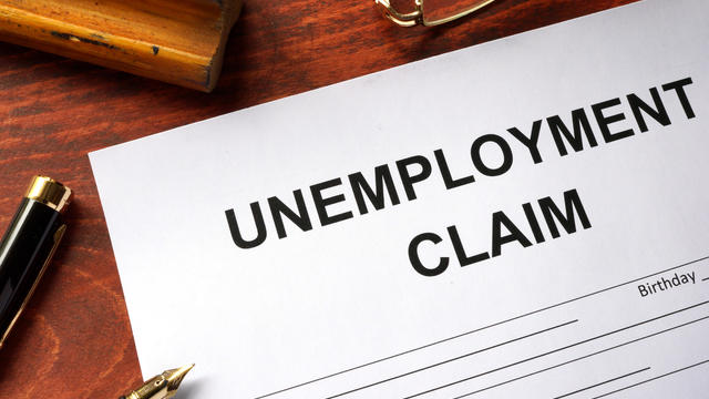 Unemployment claim form on an office table. 