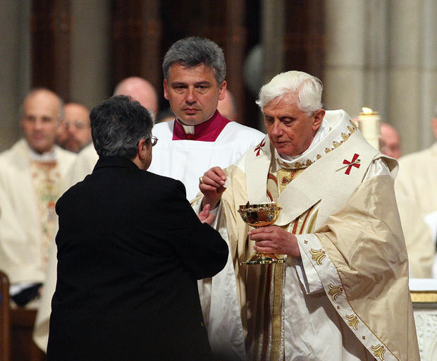 Pope Benedict XVI gives communion at Sai 