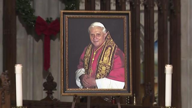 A portrait of Pope Emeritus Benedict XVI displayed in St. Patrick's Cathedral. 