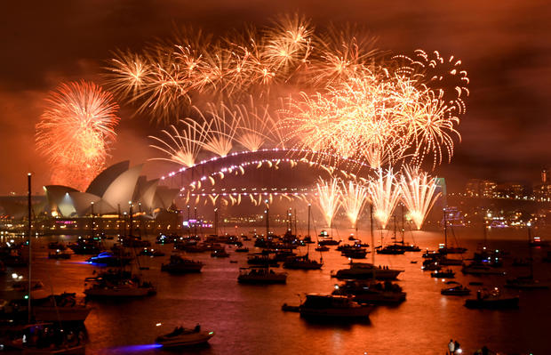 Sydney Harbour, Australia, January 1, 2023: Fireworks explode above the city during New Year's celebrations 