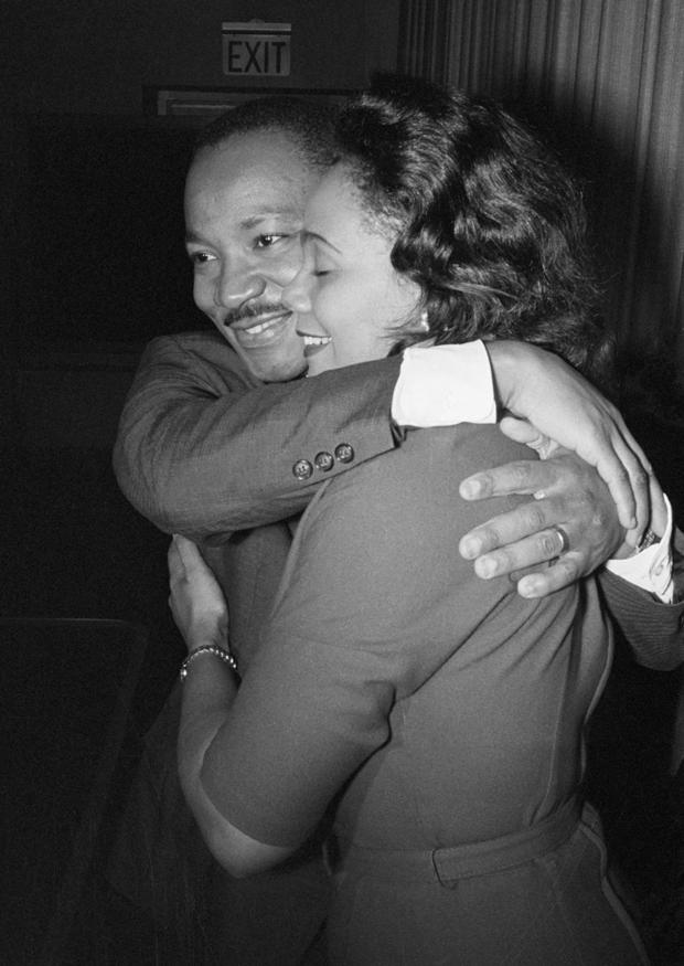 Dr. Martin Luther King, Jr.  He hugs his wife, Coretta 