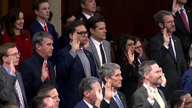 George Santos and other members of the 118th Congress raise their right hands as they're sworn into Congress. 