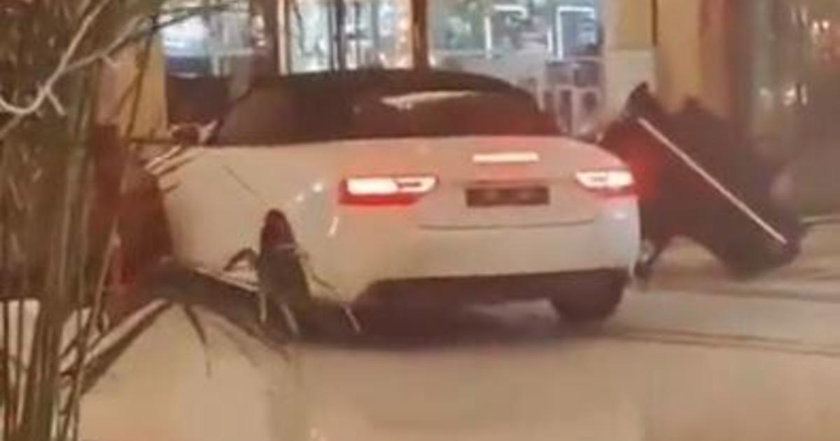 Wild video shows angry guest smashing sports car through Chinese hotel lobby: “Are you crazy?”