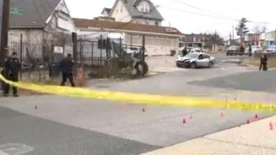 Police vehicles with overhead strobe lights at a crime scene 