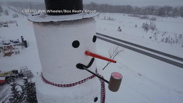 At 4-stories tall, Jeffrey the Snowman dazzles passersby in