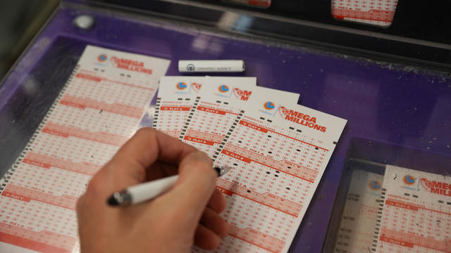 A person plays Mega Millions lottery at a store in San Mateo, California, United States on January 12, 2023. 