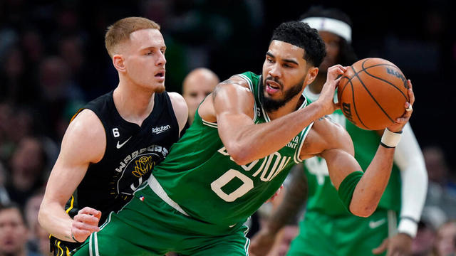 Boston Celtics forward Jayson Tatum and Golden State Warriors guard Donte DiVincenzo 