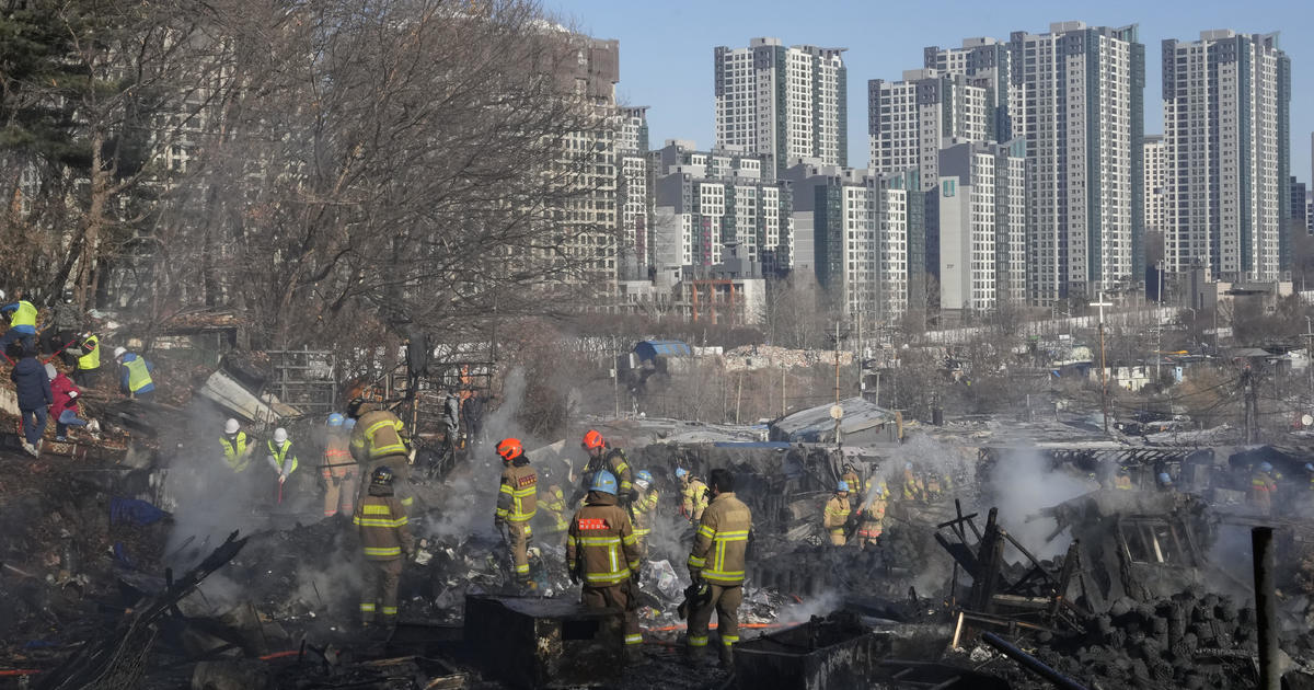 Fire guts makeshift homes in illegal village on edge of wealthy Seoul