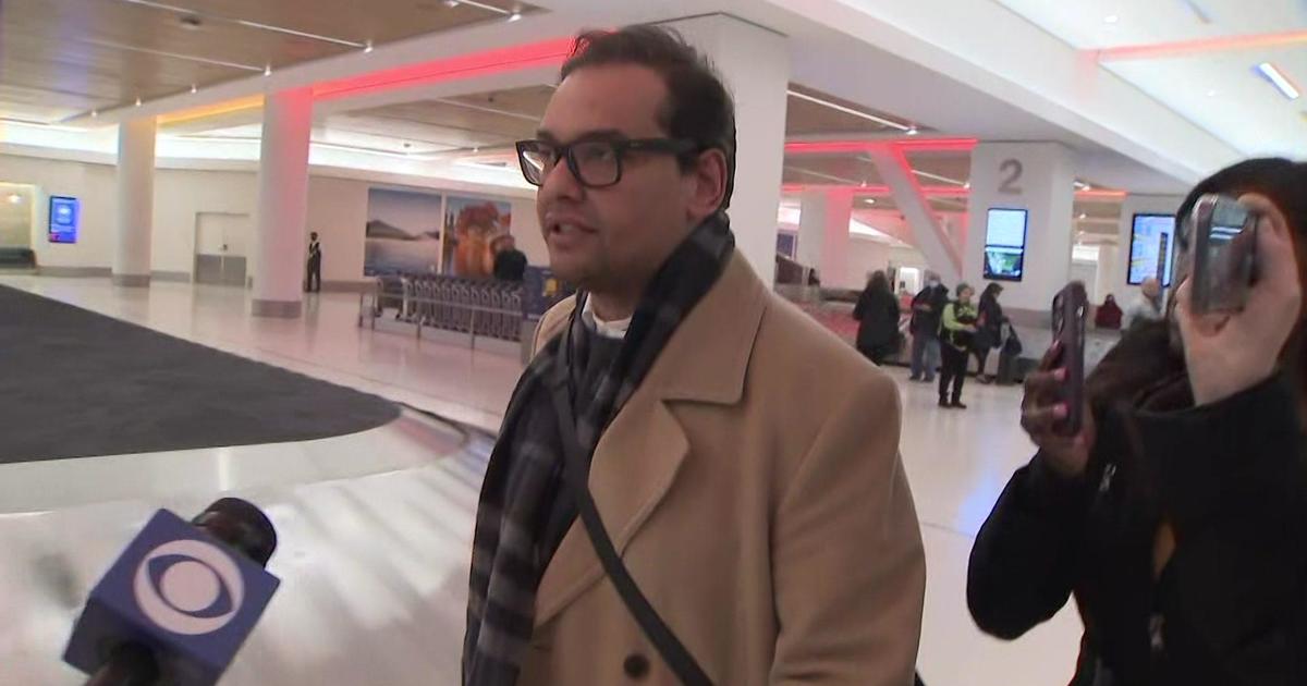 Rep. George Santos addresses "drag queen" photos and other accusations with reporters at airport