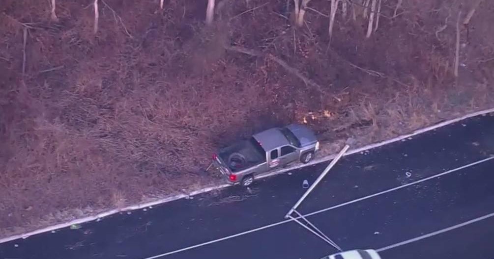 Car spins out on icy ramp, crashes into light pole getting onto Route