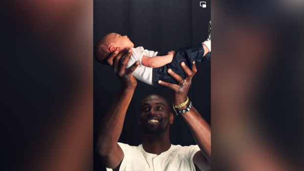 Photo of Tyre Nichols holding his son 