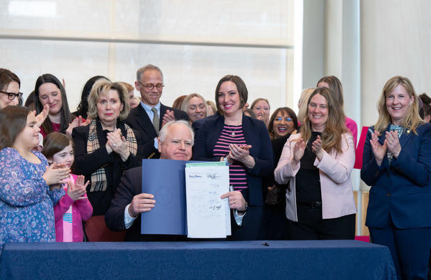Gov. Tim Walz signs a bill to add a fundamental right to abortion access into state law on Tuesday, Jan. 31, 2023, in St. Paul, Minnesota. 